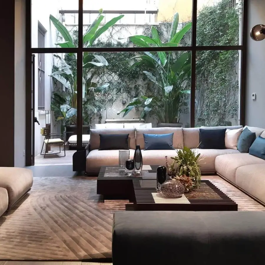 Captivating Giorgetti Adam sectional with light beige fabric, pewter painted metal and stylish blue goose down cushions