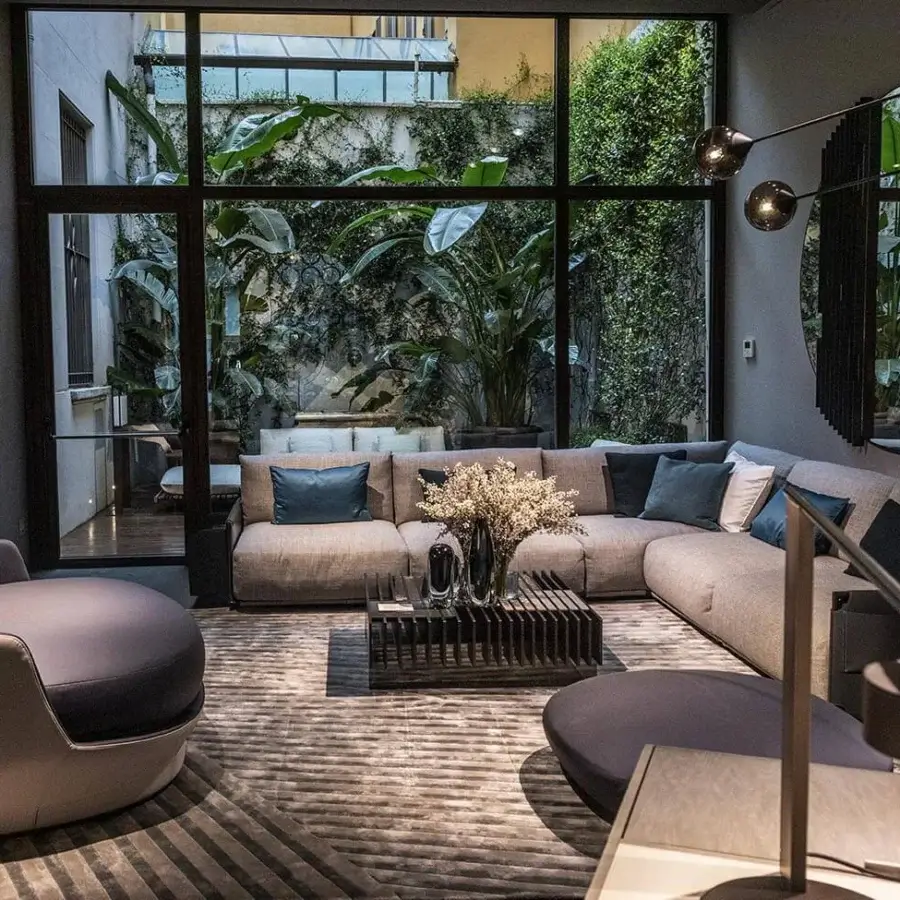 Exclusive Giorgetti Adam sectional with refined fabric upholstery, pewter painted metal and goose down cushions