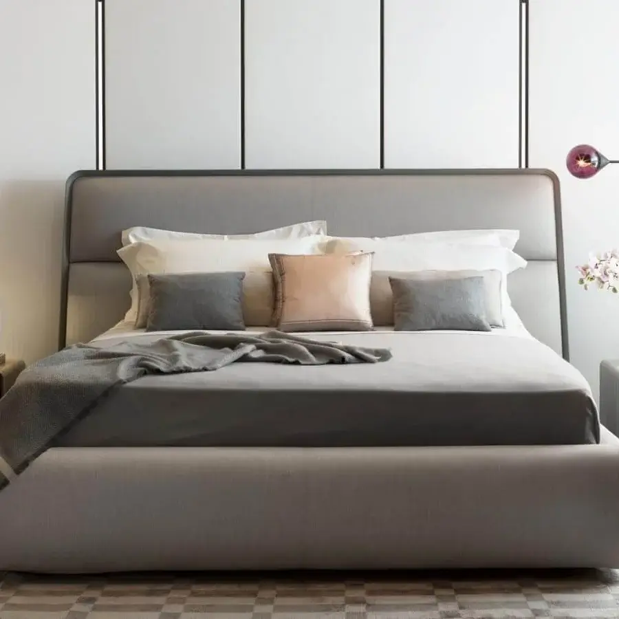 Elegant Giorgetti Frame bed with saddle leather headboard and gray textile finish exhibiting a sleek low profile