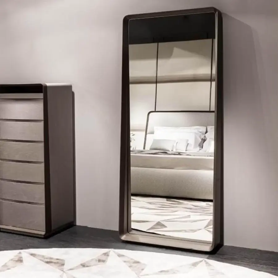Distinguished Giorgetti Frame dresser crafted with maple wood, saddle leather detail and sand painted Fiddleback Sycamore interiors in a matte finish