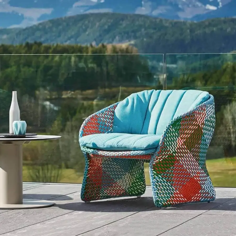 Lavish Varaschin Maat lounge chair with hand-woven synthetic fiber frame and powder-coated aluminum base in teal, red, green, and white hues