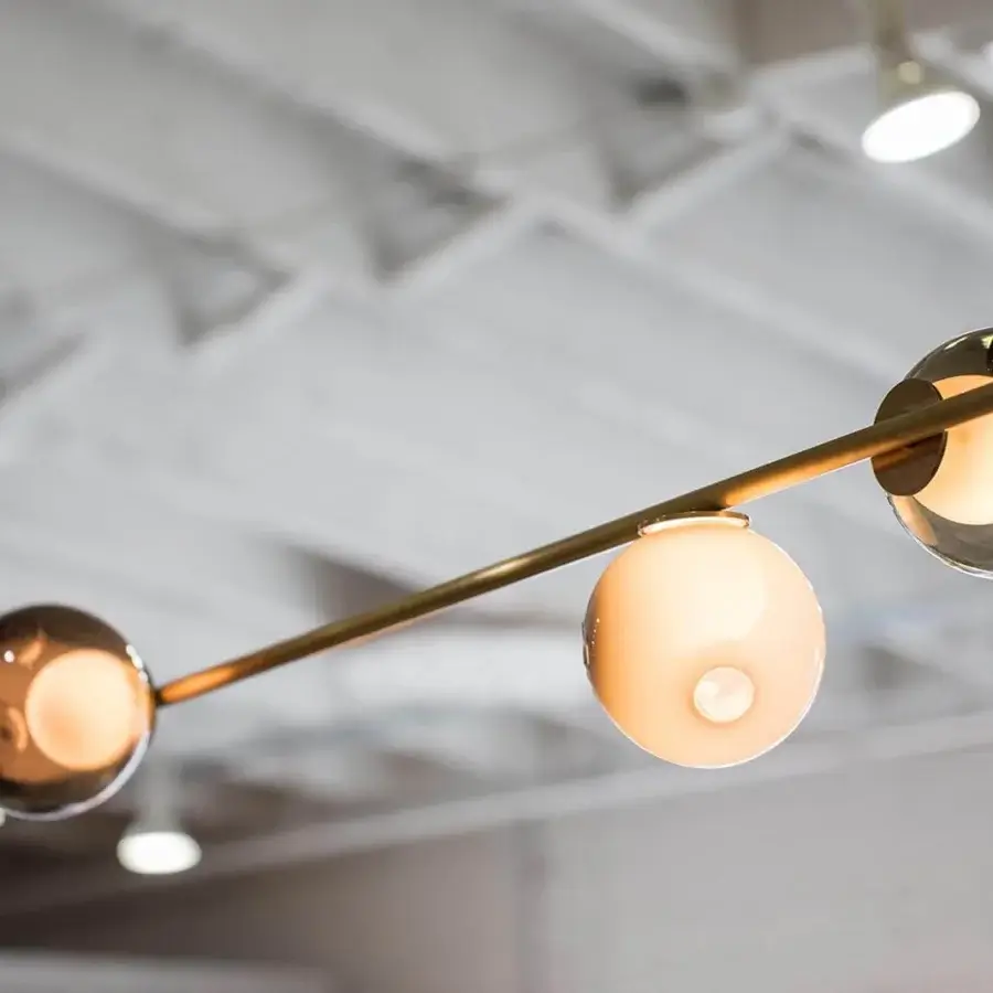 Superior Bocci 28 Stem suspension lamp with unlacquered brass stem and spherical glass diffusers in reflective tint and matte finish