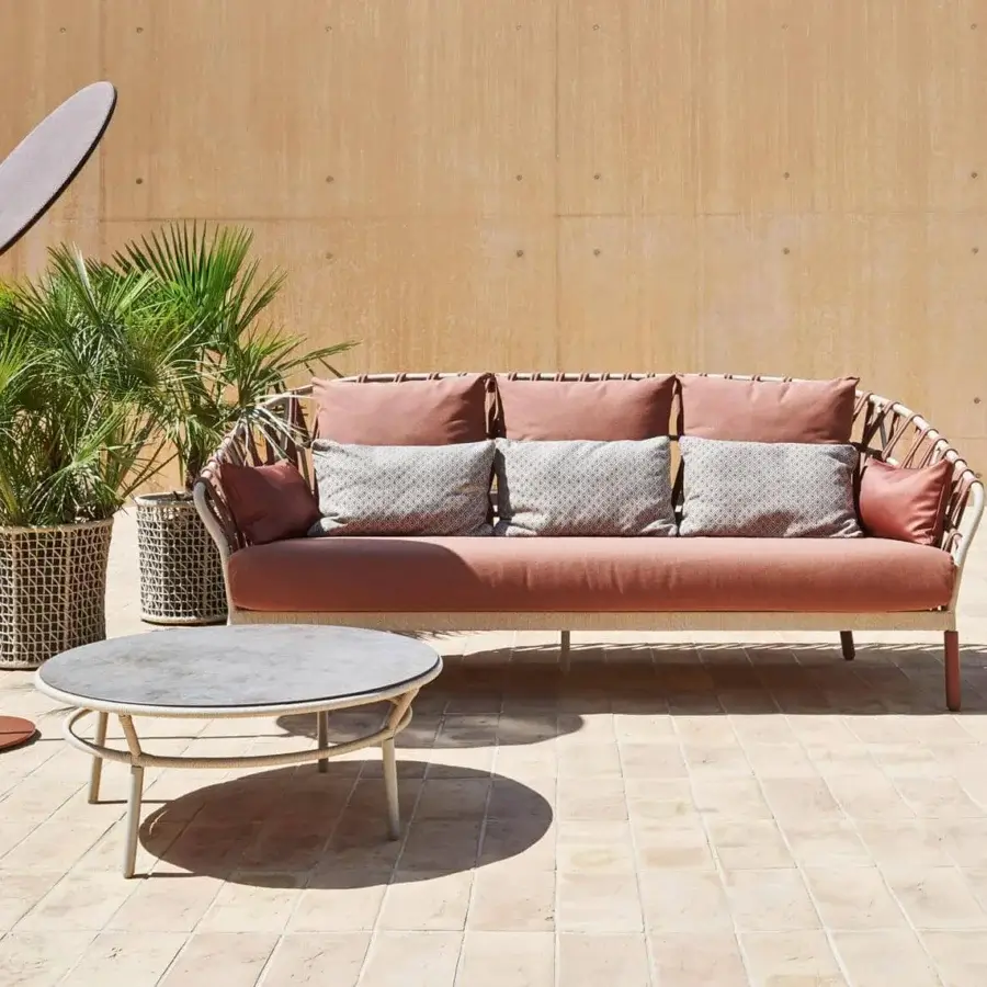 Superior Varaschin Emma Cross coffee table with flared form in bush-hammered ceramic and light synthetic fiber rope weave