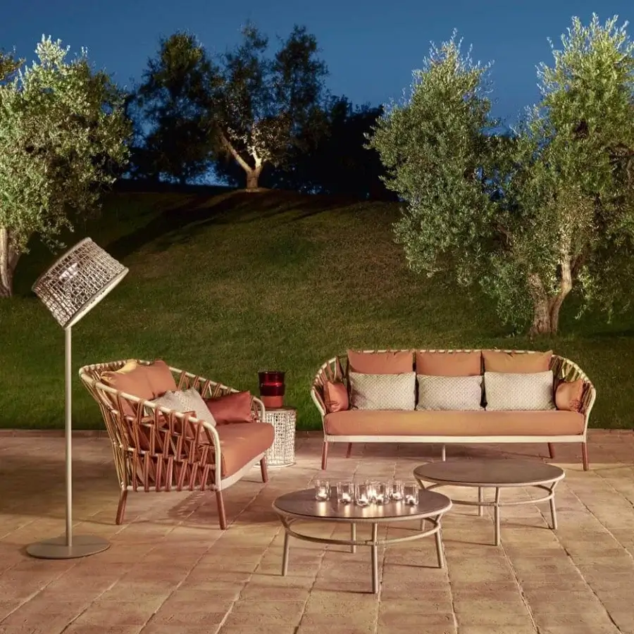 Exceptional Varaschin Emma Cross sofa crafted with light brown handwoven acrylic fabric and plush peach cushions