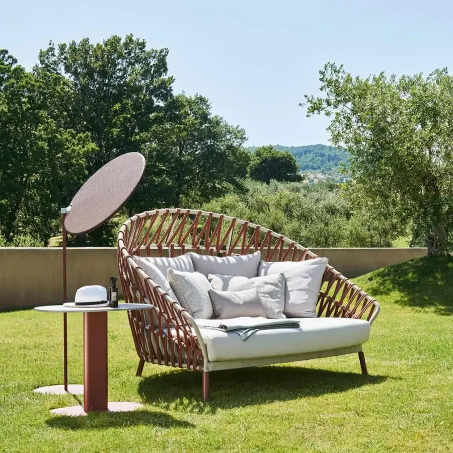 Distinguished Varaschin Emma Cross daybed with handmade acrylic fabric weaving on a powder-coated aluminum frame and light gray cushions
