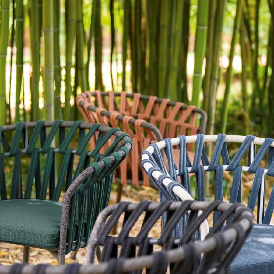 Exceptional Varaschin Emma Cross armchair with powder-coated aluminum frame and woven terracotta acrylic fabric bands with Dryfeel padding