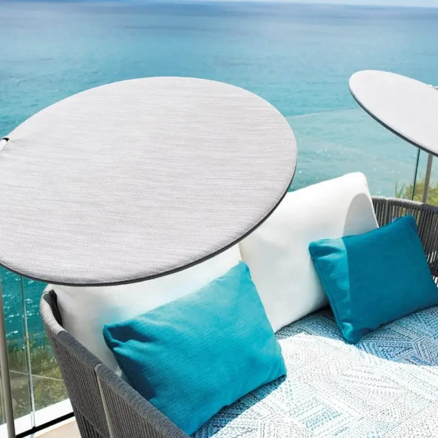 Distinguished Varaschin Emma sunshade with light gray micro-perforated technical PVC fabric and slim profile