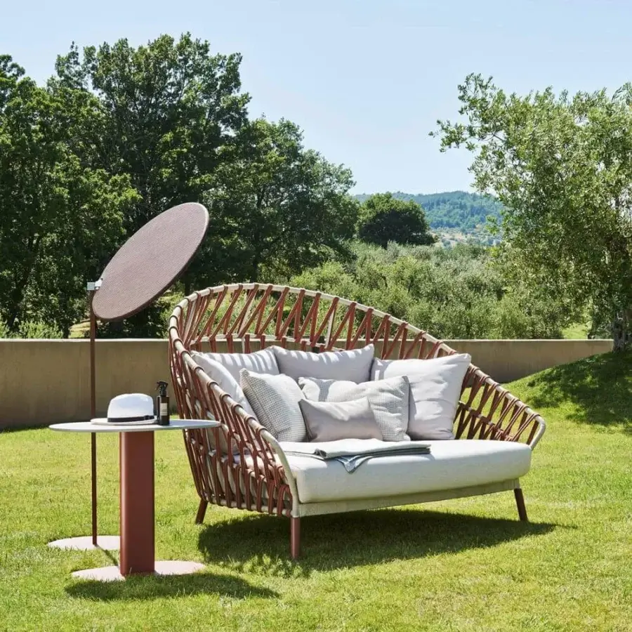 Elegant Varaschin Emma sunshade with reddish-brown metal frame and micro-perforated technical PVC fabric for filtered light