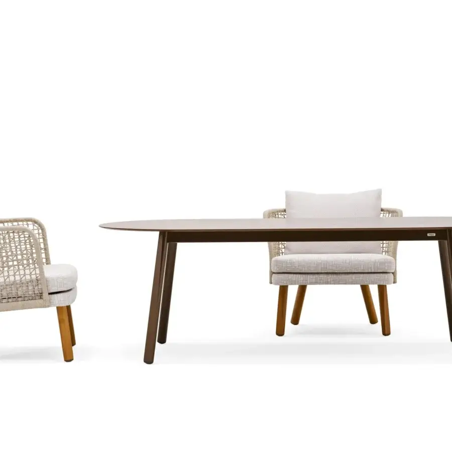 Distinguished Varaschin Emma table with a smooth light brown HPL top and elegantly tapered dark brown Iroko wood legs