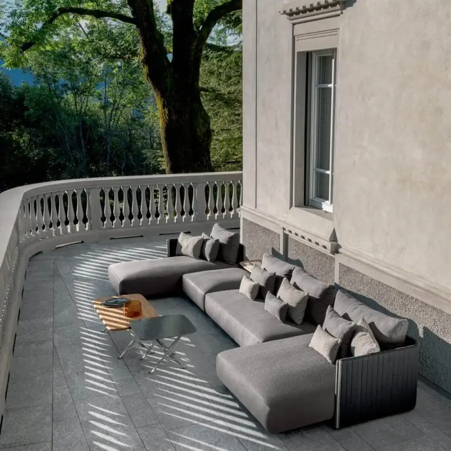 Distinguished Talenti George sectional with lightly padded synthetic ropes, soft gray cushions and durable stainless steel uprights