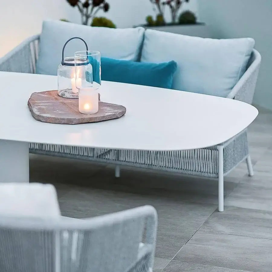 Distinguished Varaschin Cricket sofa with light gray handmade rope weaving enveloping a light aluminum frame with plush light blue cushions