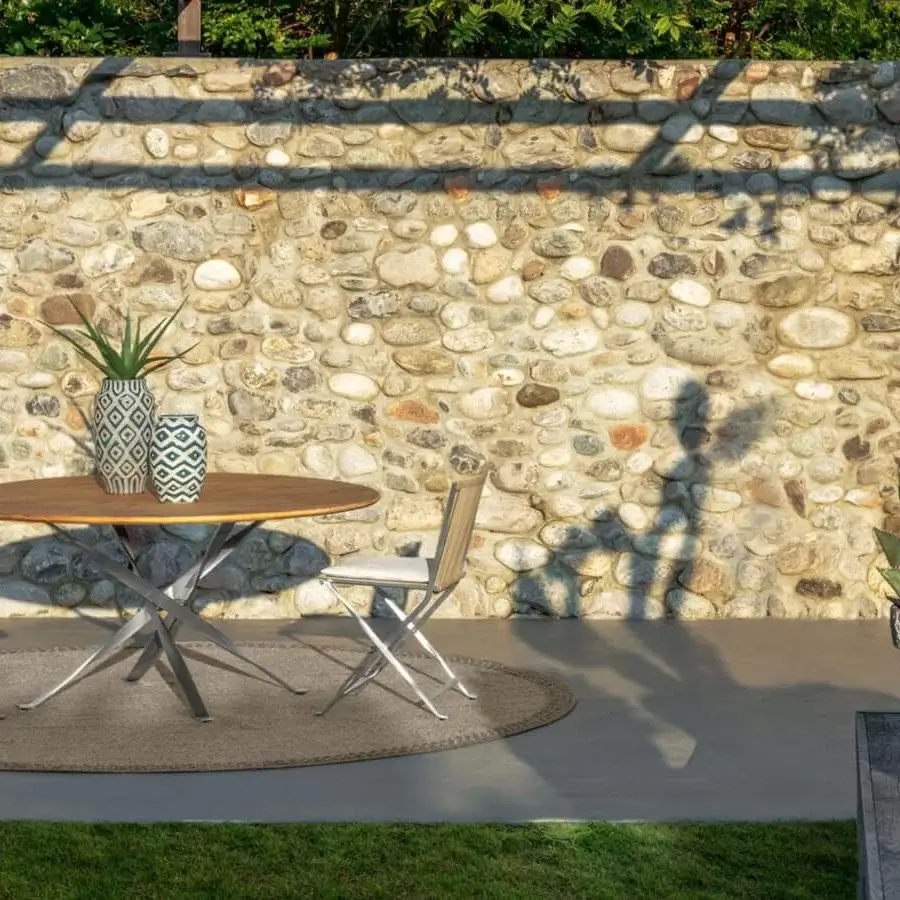 Elegant Talenti George table with smooth accoya wood top and stainless steel base in warm brown