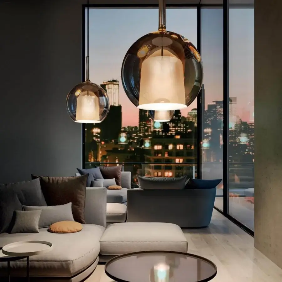 Elegant Penta Glo Maxi suspension lamp with translucent amber mirrored glass and sandblasted inner shade crafted in varnished titanium metal