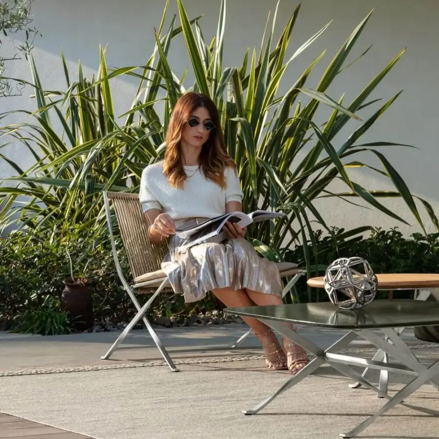 Elegant Talenti George coffee table in weather-resistant lava stone with a matte silver stainless steel frame