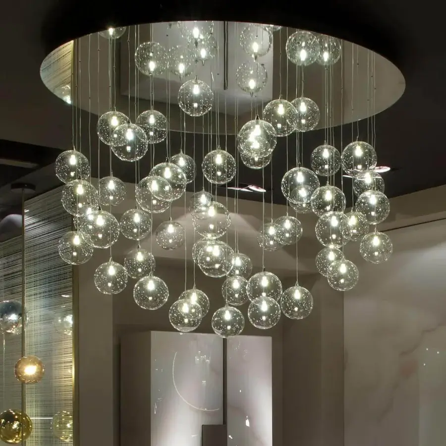 Distinguished Reflex Bulles suspension lamp with clear glass spheres and delicate metal cables in a glossy finish