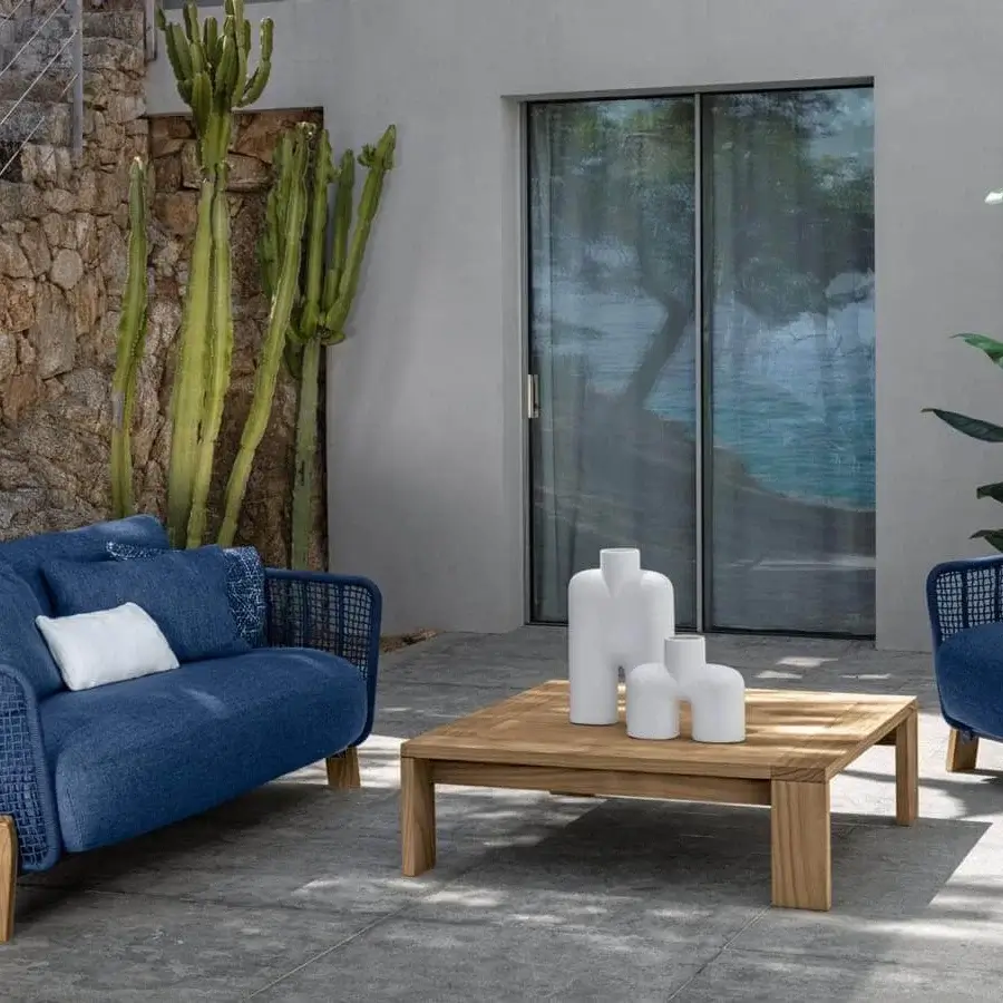 Distinguished Talenti Argo Wood lounge chair with blue woven rope and plush cushion crafted in wood for sophisticated outdoor spaces
