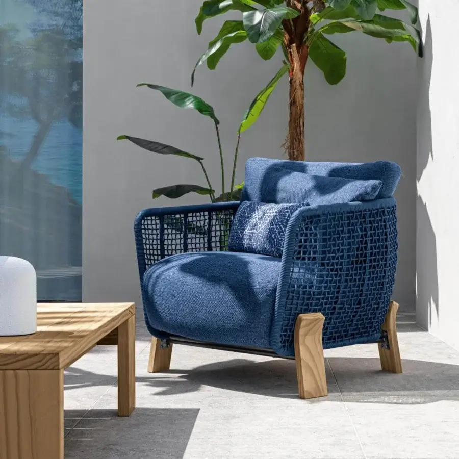 Exceptional Talenti Argo Wood lounge chair with woven blue textile cushions and matte wooden legs