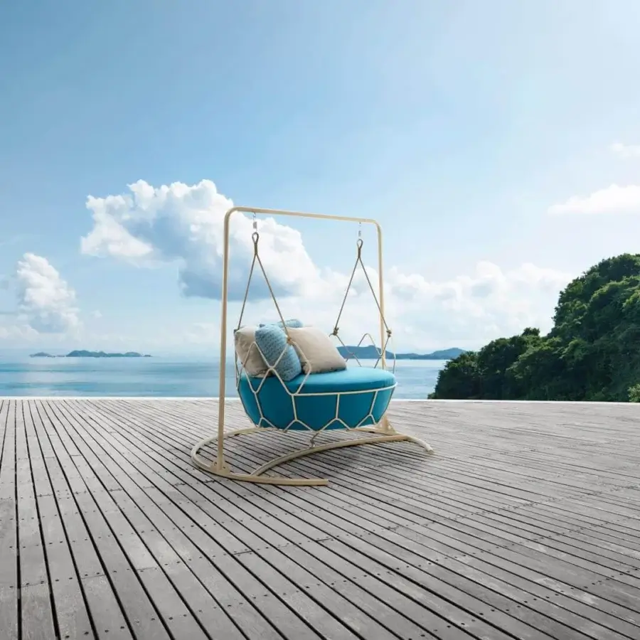 Captivating Roberti Rattan Gravity Swing Lounge Chair in light blue textile with powder-coated 304 steel and durable Nautic rope support