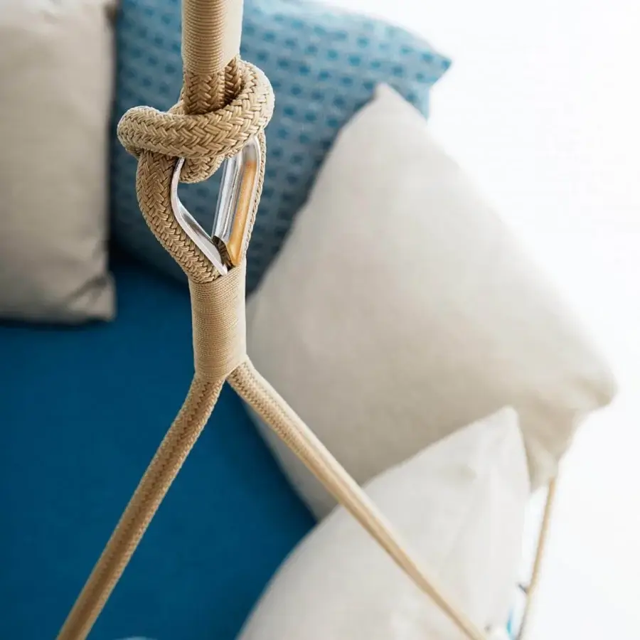Superior Roberti Rattan Gravity Swing Lounge Chair with 304 steel, Nautic rope, beige and blue plush pillows, crafted with 316 steel details