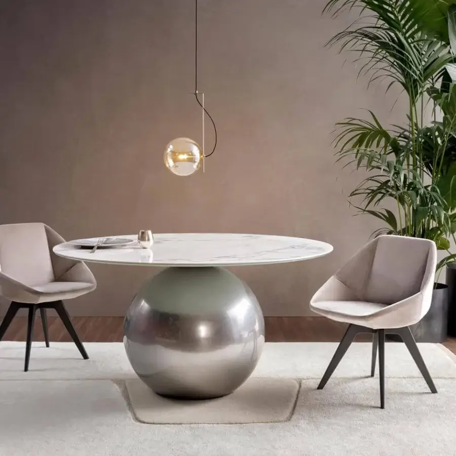 Captivating Bonaldo Circus table with white marble-look ceramic top and reflective metallic silver metal base
