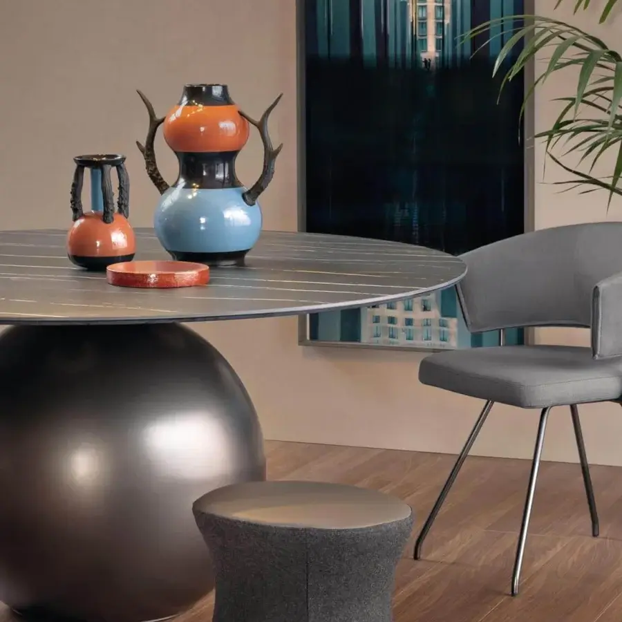 Exceptional Bonaldo Circus table with dark grey streaked ceramic tabletop and spherical reflective metal base