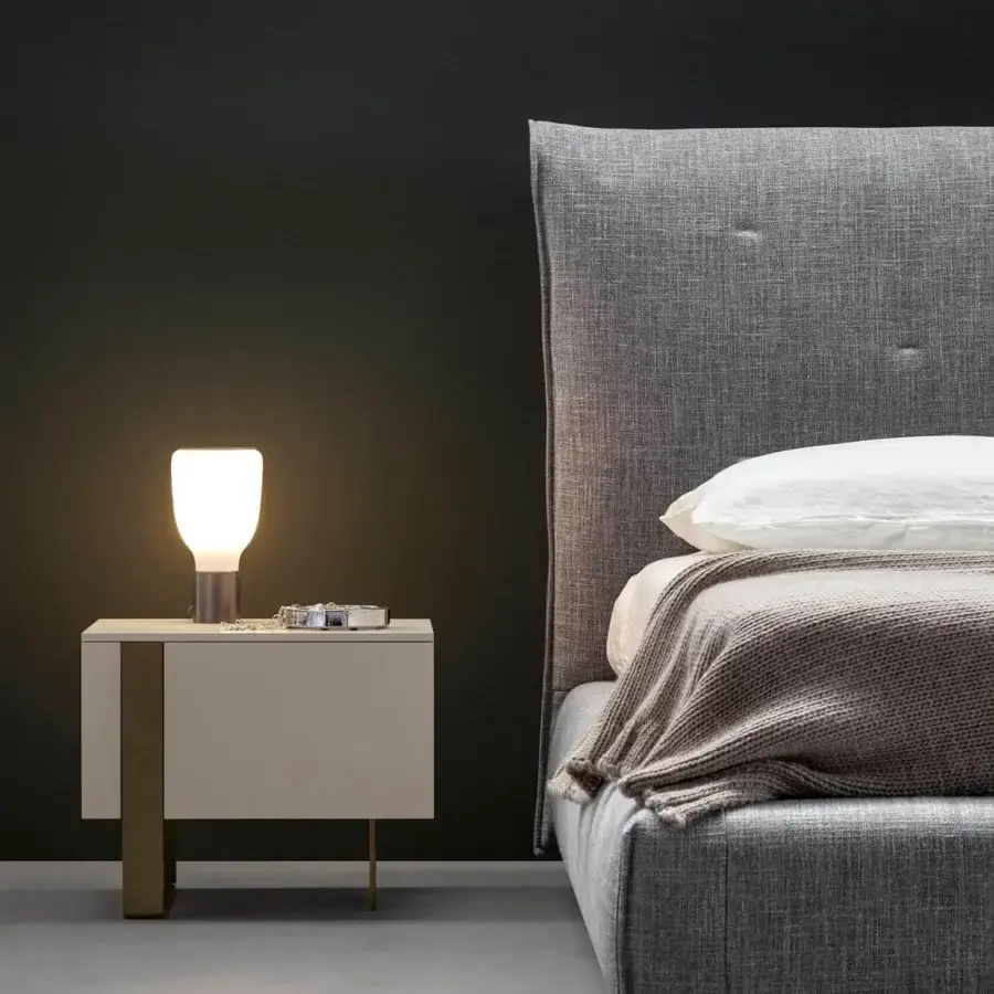 Distinguished Bonaldo Antibes nightstand with neutral lacquered wood and asymmetrical bronze finish metal base