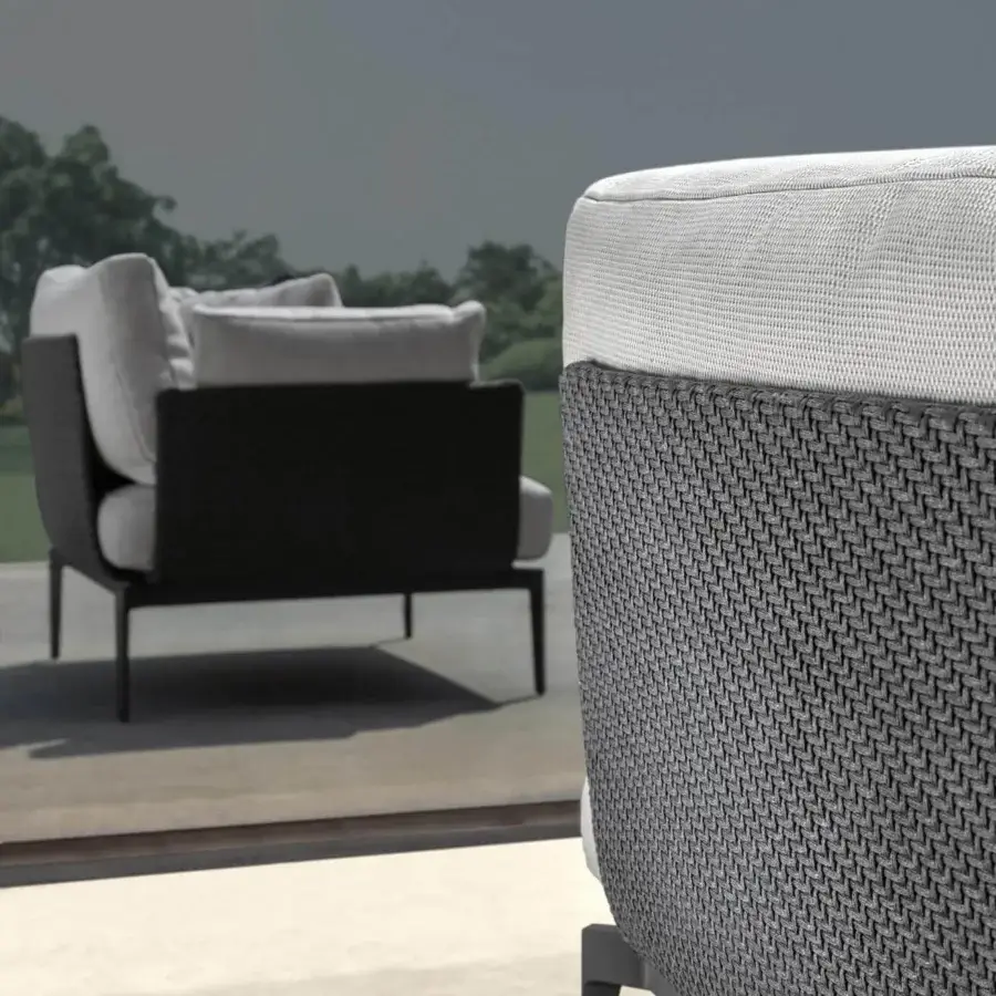 Lavish Talenti Leaf lounge chair with light aluminum structure and soft light gray textile cushions crafted with a dark woven finish