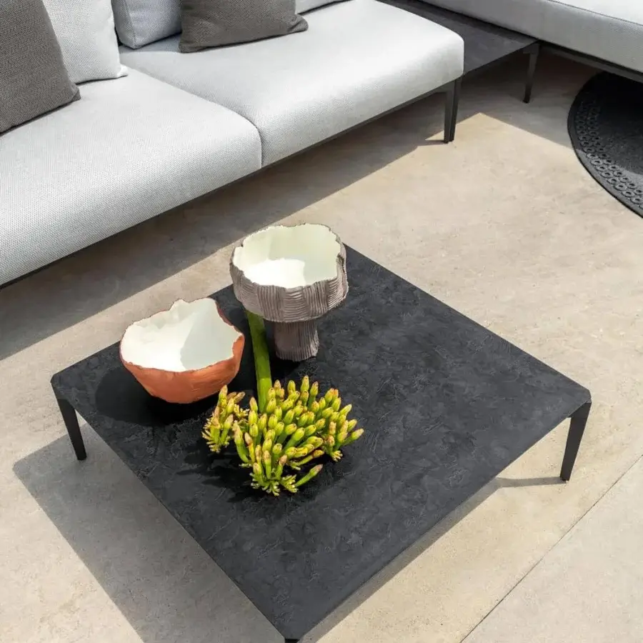 Superior Talenti Leaf sectional with a light gray fine weave textile, dark cushions and durable aluminum structure with matte finish