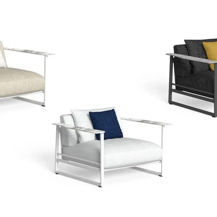 Exclusive Talenti Riviera lounge chair with light aluminum, textured beige cushions and stylish stoneware armrests