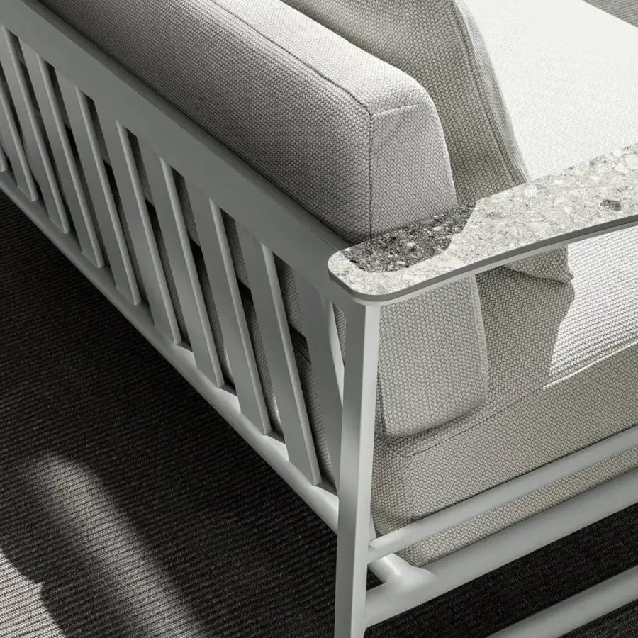 Distinguished Talenti Riviera sofa with light gray powder-coated aluminum frame and textured textile cushions with stoneware armrests