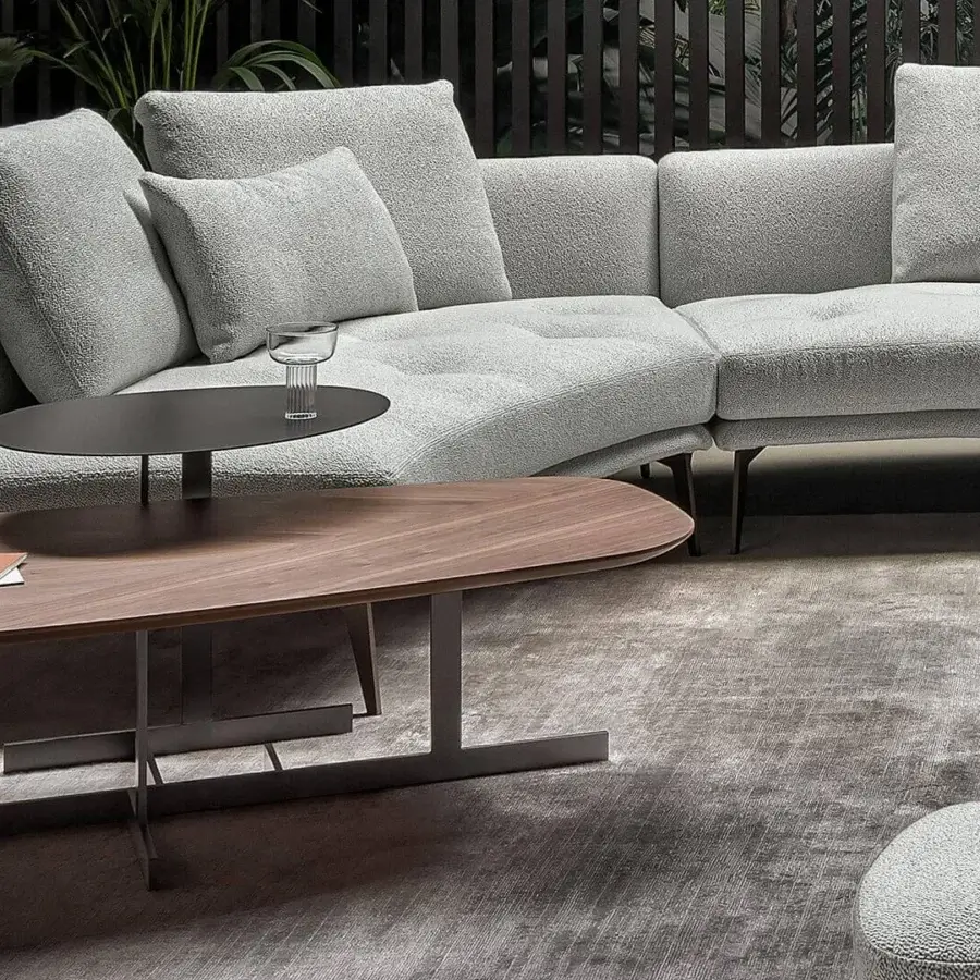 Distinguished Bonaldo Kumo side table with bold geometric metal base and curved top in matte dark finish