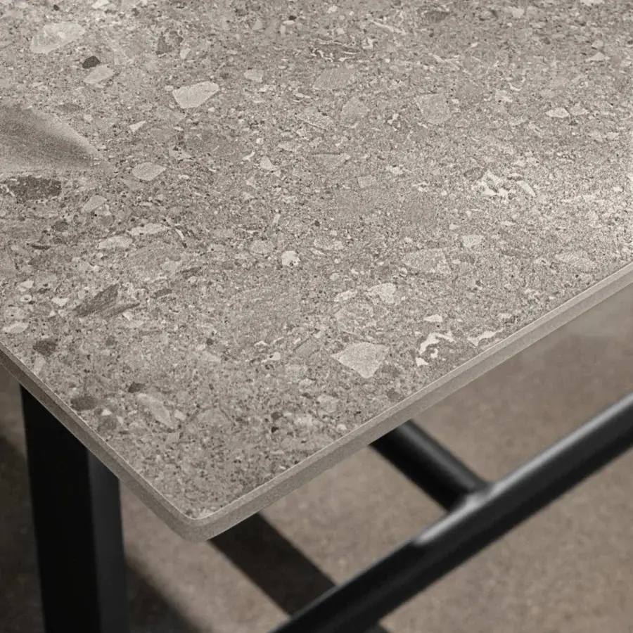 Refined Talenti Riviera coffee table with textured gray stoneware top and matte black linear aluminum base