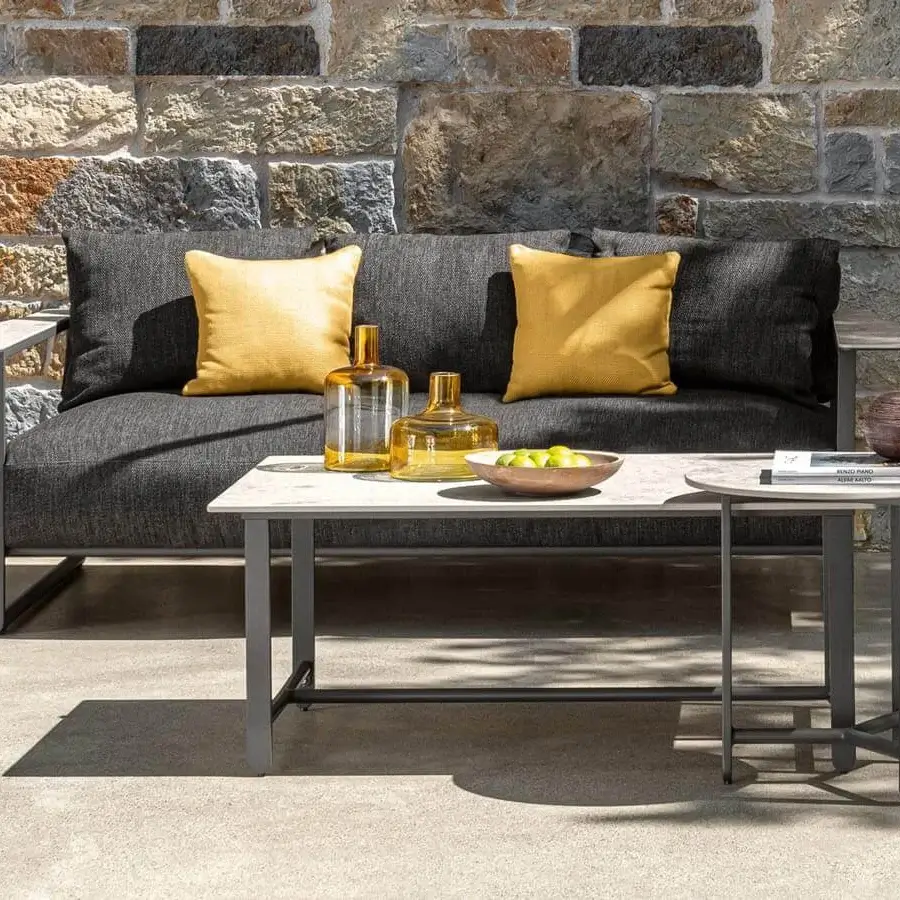 Distinguished Talenti Riviera coffee table with light gray stoneware top and dark gray aluminum base in matte finish
