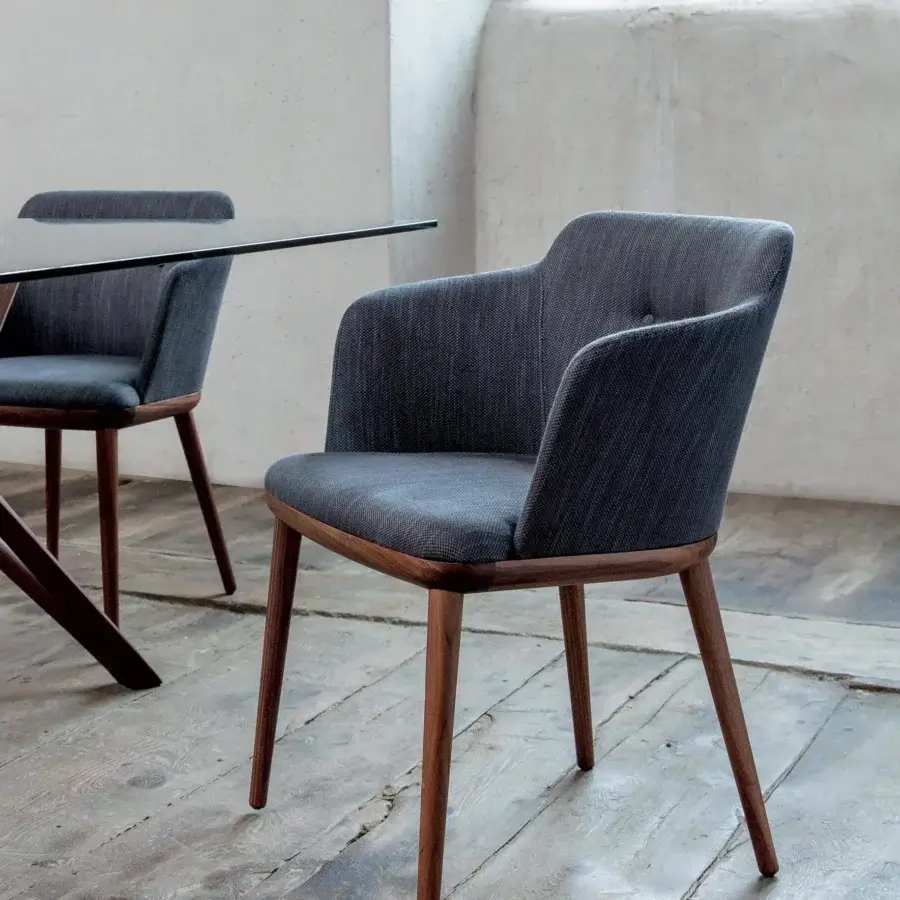 Exceptional Porada Celine armchair with Canaletto walnut wood frame and plush dark gray textile upholstery with satin finish