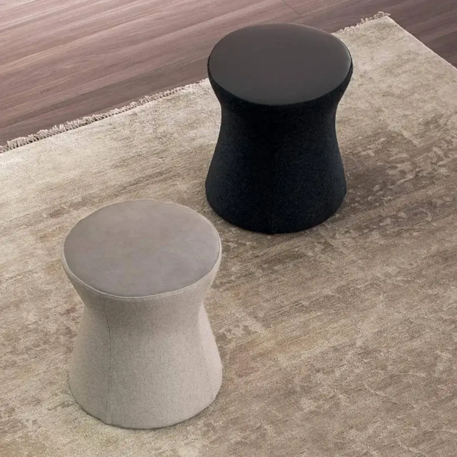 Distinctive Bonaldo Clessidra ottoman with light gray textile upholstery and a smooth darker gray top