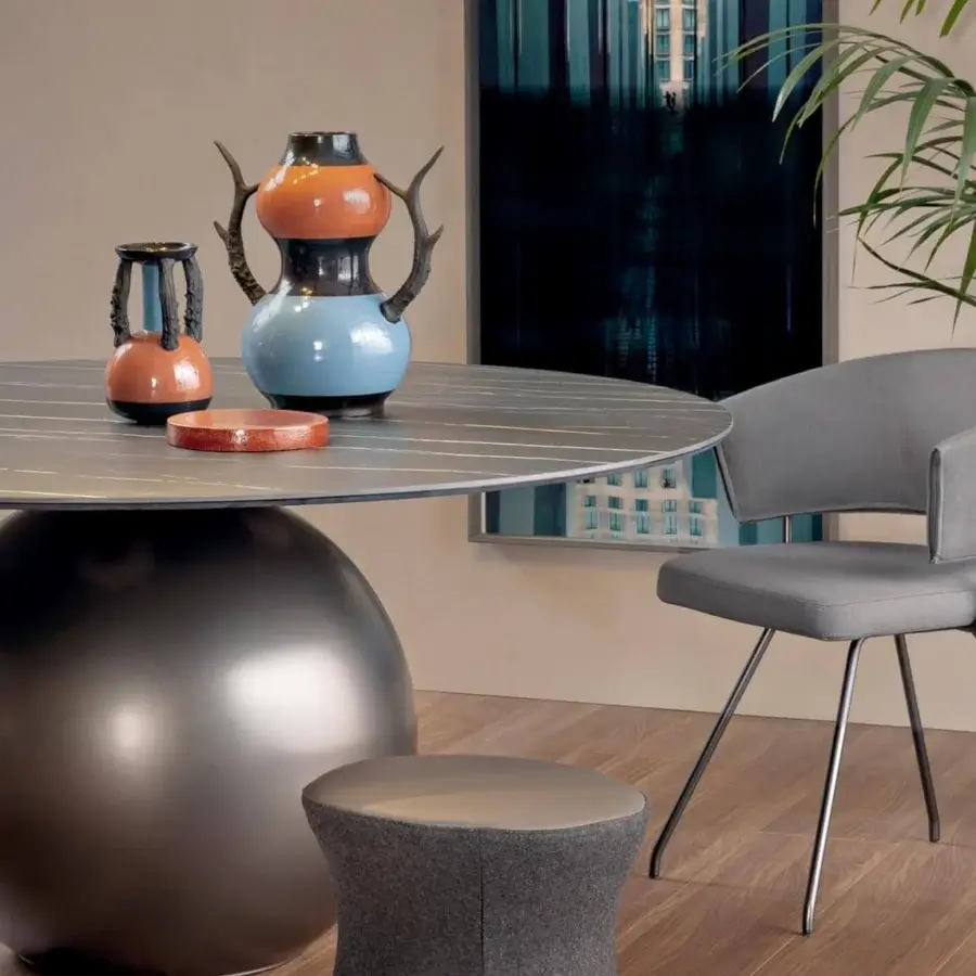 Captivating Bonaldo Clessidra ottoman with light gray and darker textured fabric upholstery and a smooth top cushion
