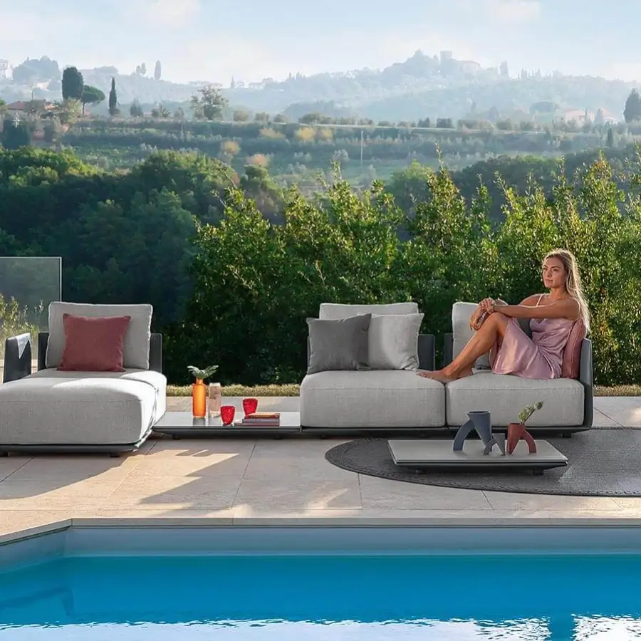 Exclusive Talenti Malè sectional with light gray woven textile upholstery and dark gray cushions exhibiting a matte finish