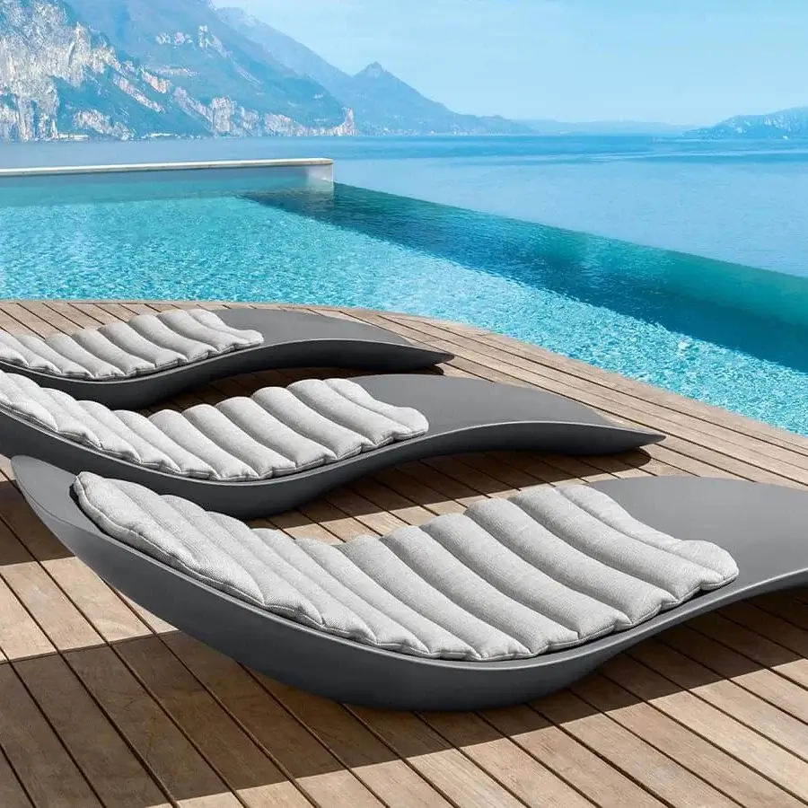 Elegant Talenti Reef lounger crafted in durable plastic with smooth matte gray finish and balanced silhouette