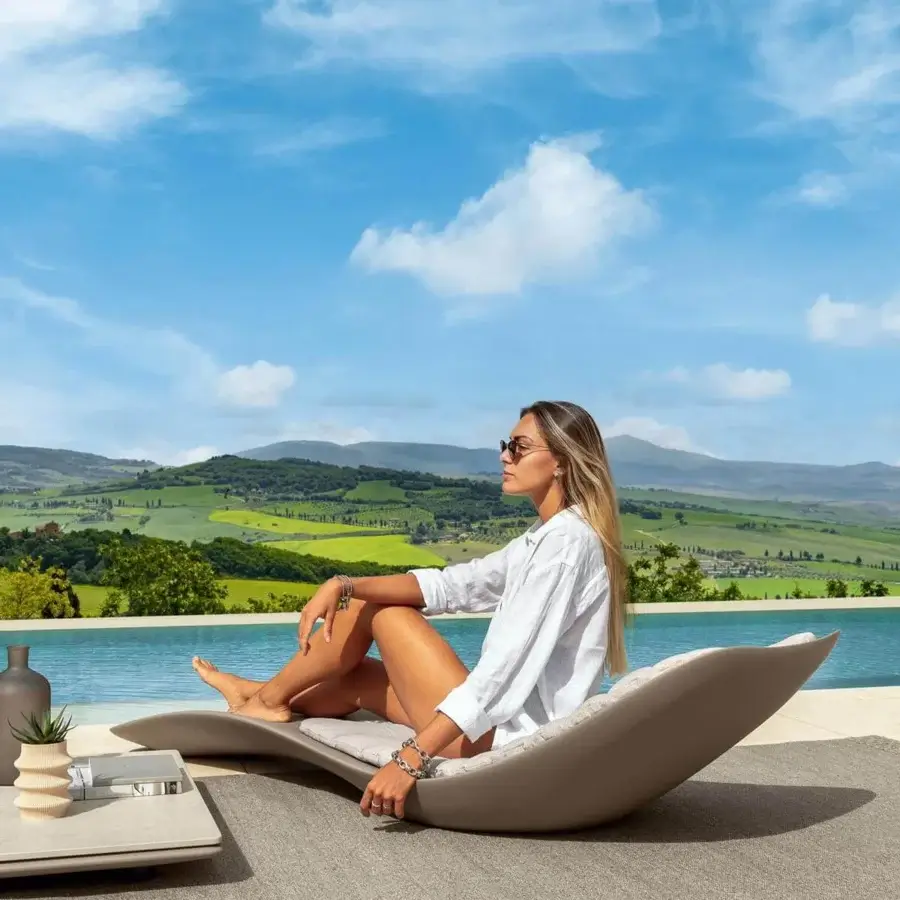 Distinguished Talenti Reef lounger crafted in resistant plastic with a matte beige finish and balanced curves