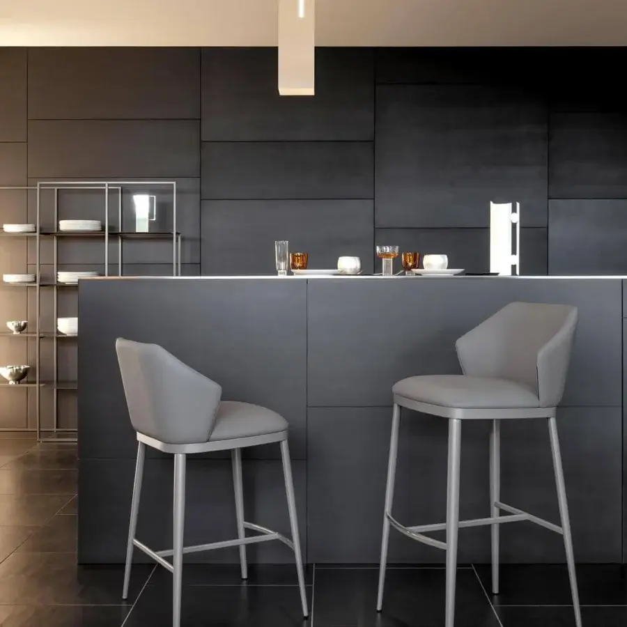 Elegant Bonaldo Mida stool upholstered in light gray fabric with a slender metal base and harmonious design