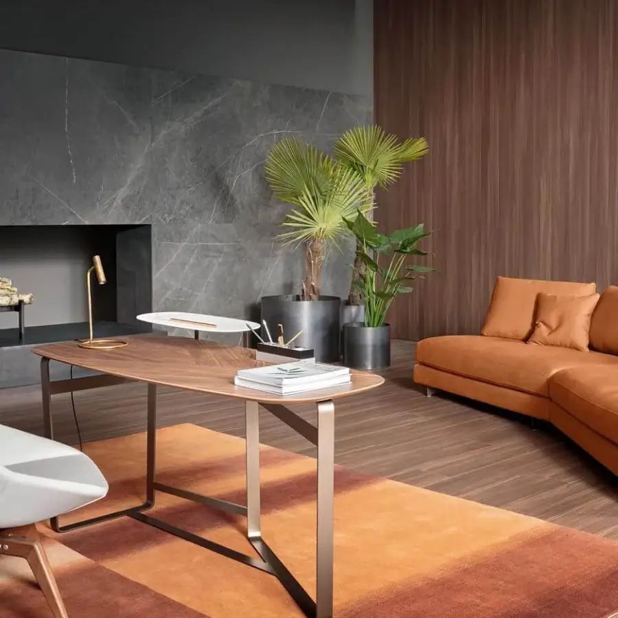 Distinctive Bonaldo Gauss desk with a curved wood top and dynamic metal legs in a smooth medium-brown finish