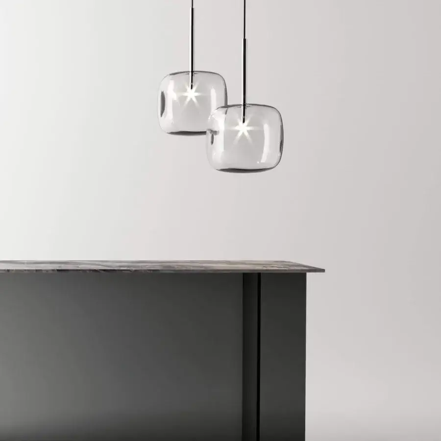 Elegant Tonelli Design Hyperion lamp with a rounded cube diffuser in transparent blown pyrex glass and chrome finish