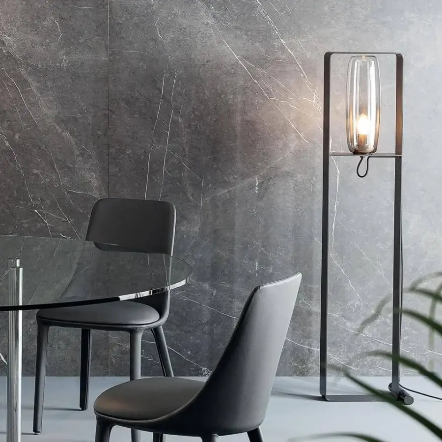 Architectural Bonaldo Bio-S floor lamp with a matte black metal structure and transparent blown glass lampshade