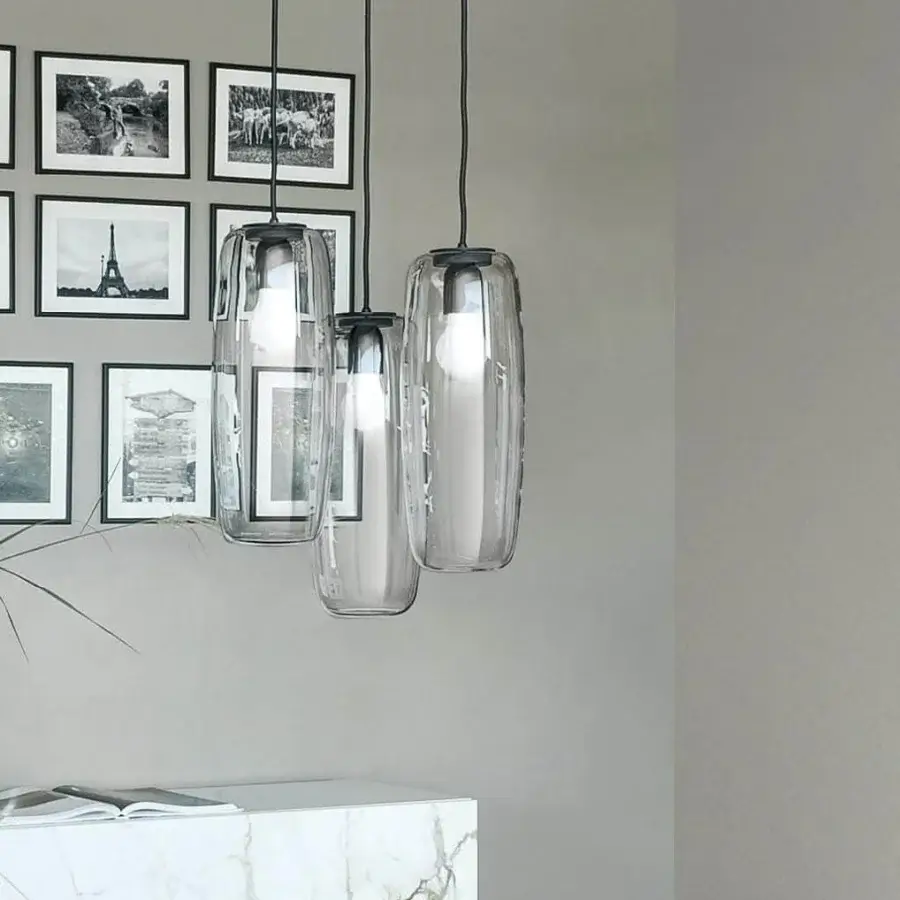 Distinguished Bonaldo Bio-S suspension lamp with a black metallic frame suspending transparent blown glass lampshades