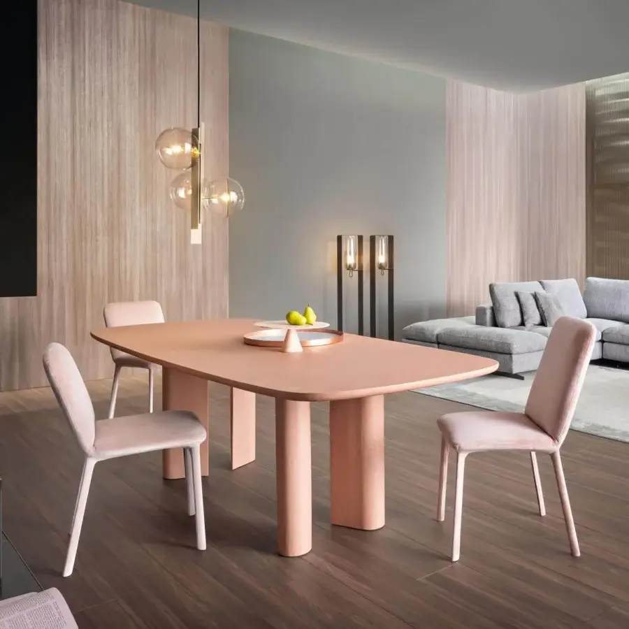 Captivating Bonaldo Geometric table with a rounded rectangular tabletop and cylindrical legs in a light salmon hue with a hand spatulated clay finish