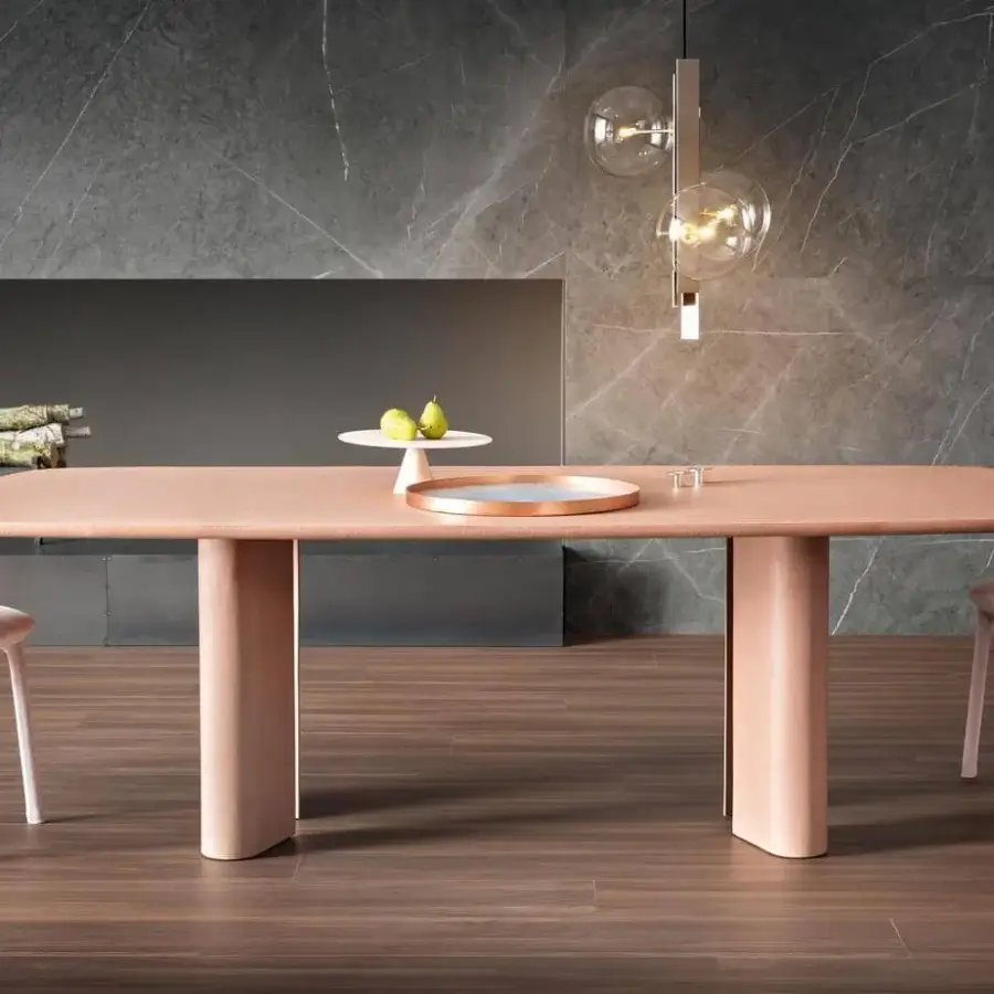 Innovative Bonaldo Geometric table with a refined top and teardrop legs crafted in hand-spatulated clay with a light pink finish