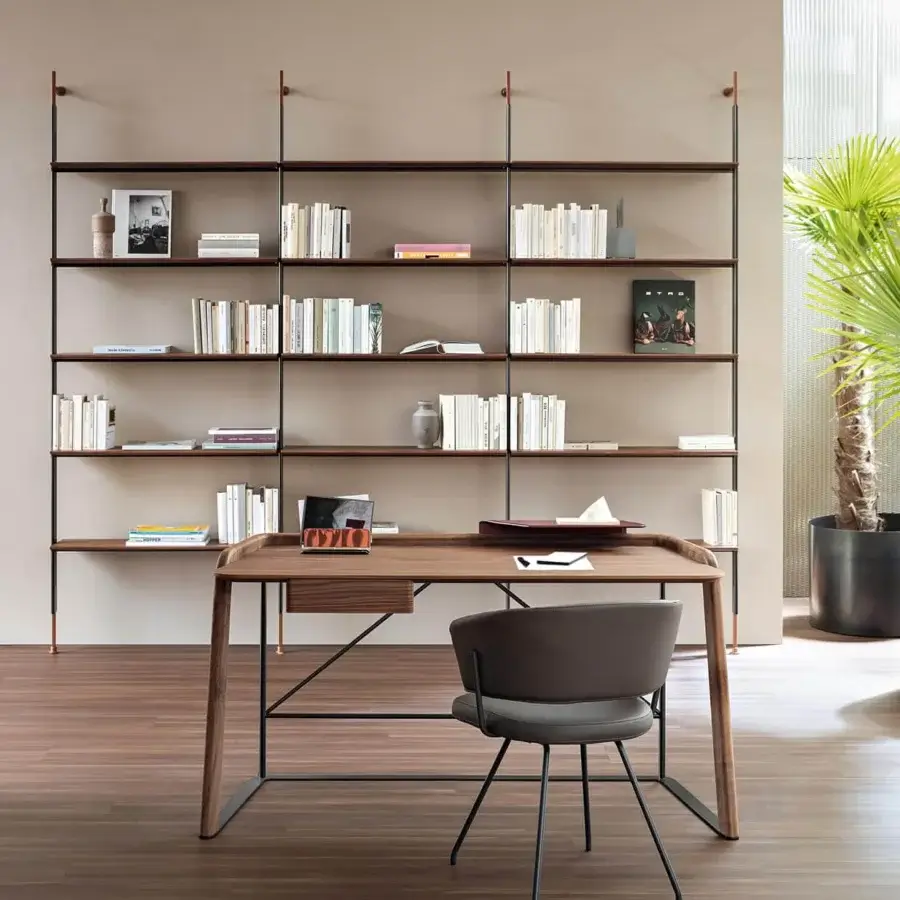 Elegant Bonaldo Roll bookcase with lead-finished metal tubes supporting dark brown wood shelves in a minimalist design
