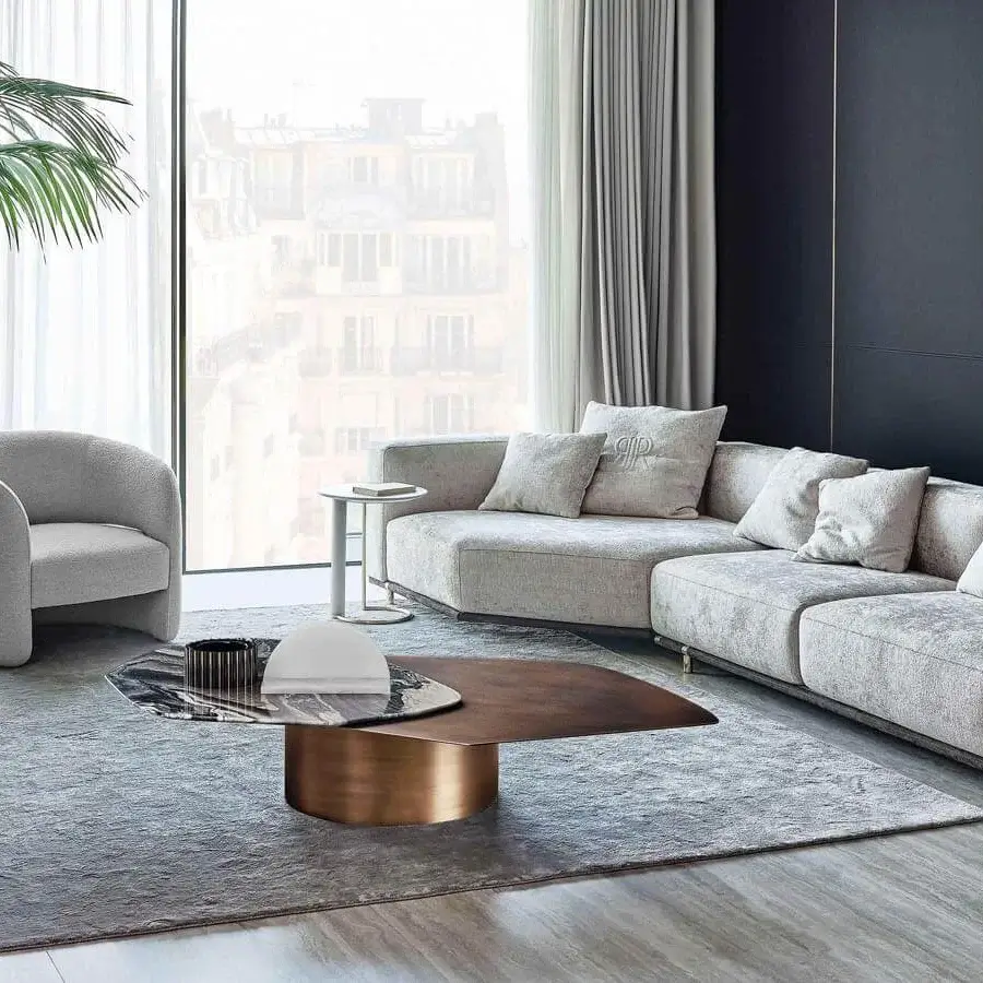 Elegant Rugiano Ambra lounge chair with embracing form upholstered in light gray textile and matte finish