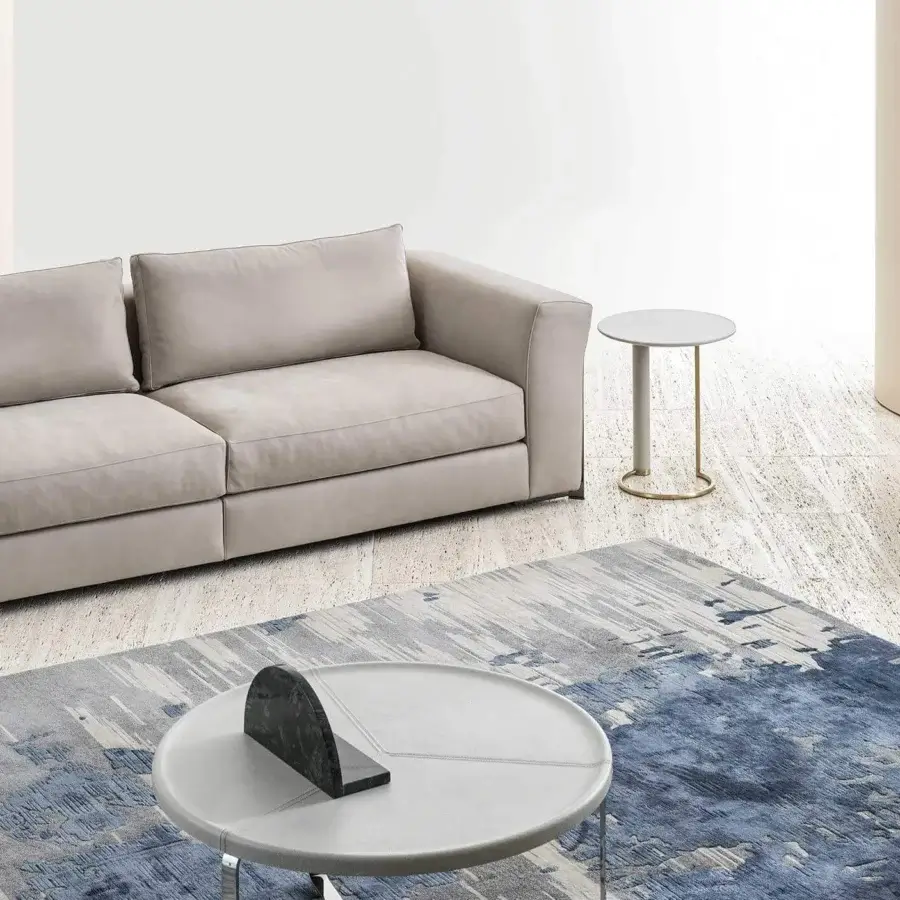 Distinguished Rugiano Opale side table with refined marble tabletop and brushed brass base crafted with a leather-covered leg