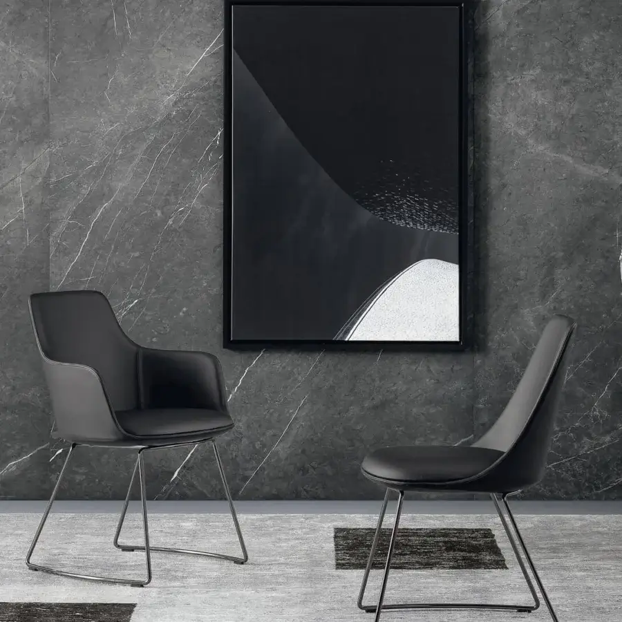 Elegant Bonaldo Itala armchair with dark gray synthetic upholstery and striking geometric metal legs